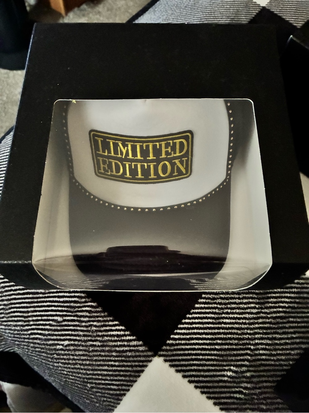Limited Edition Black and White Trucker Hat with Gold Patch